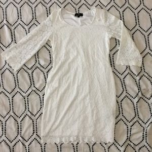 White dress. Knee length w/ elbow length sleeves